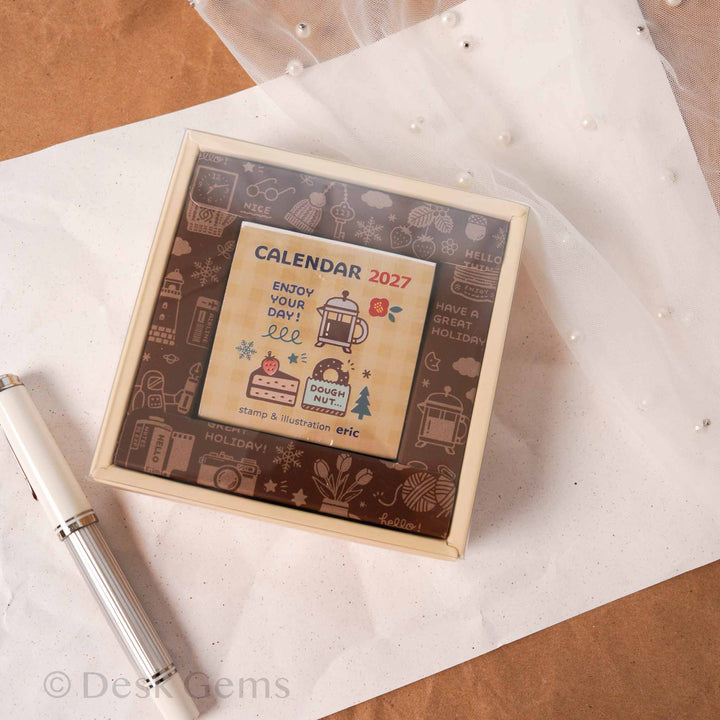 Eric Small Things Mini Daily Calendar 2027 brown frame packaging with warm-toned cover illustration