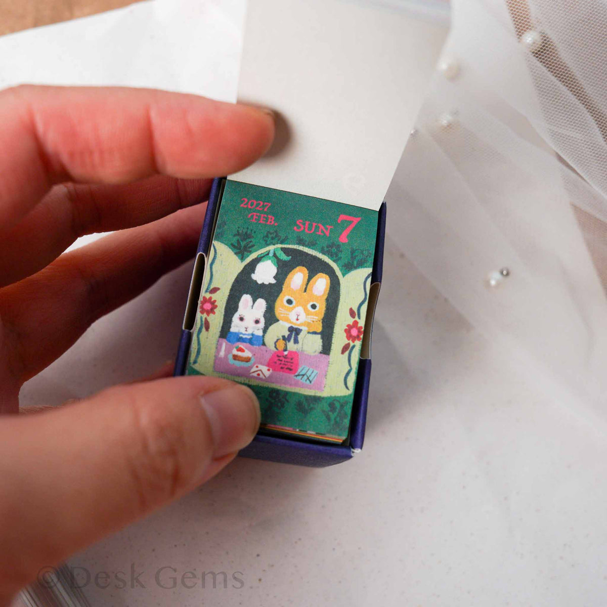 Yumi Kitagishi Mini Mini Daily Calendar 2027 open showing page with bunnies at a tea party