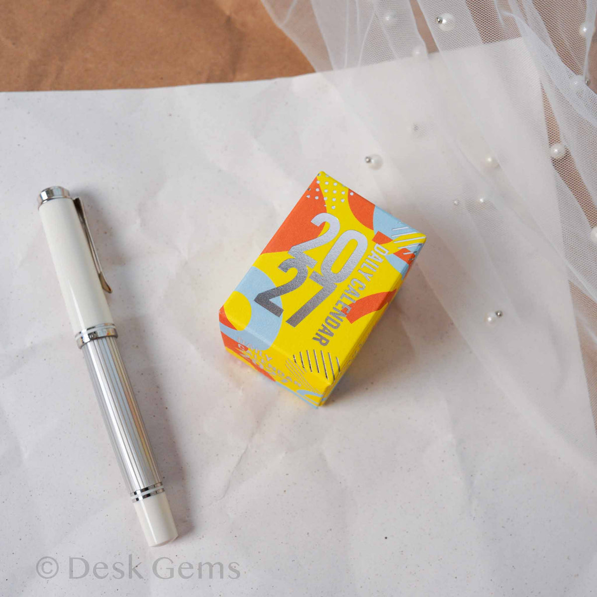 Shinnippon Mini Mini Daily Calendar 2027 Dates yellow and orange box with bold 2027 typography