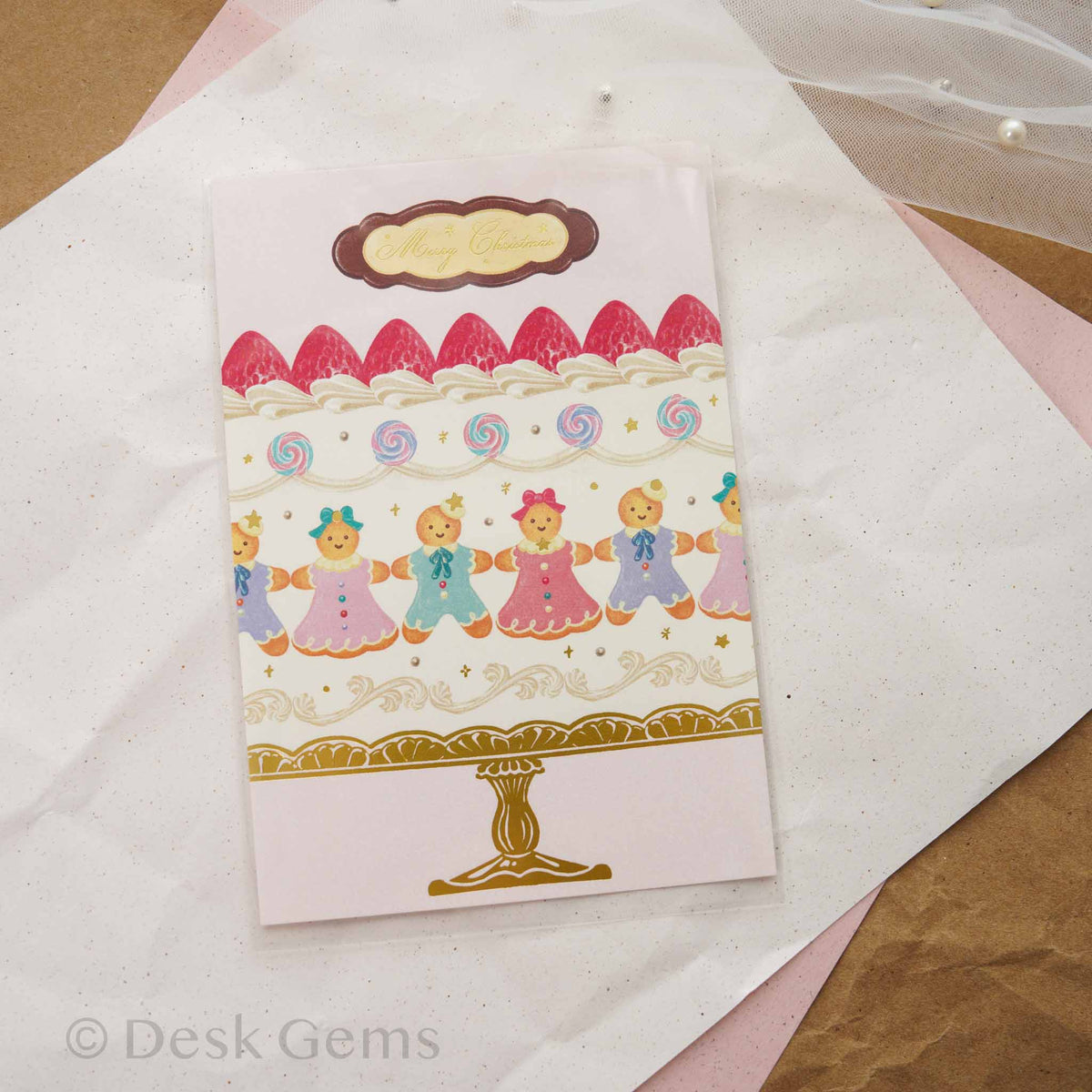 Arakarudo Christmas postcard with tiered cake decorated with gingerbread people and strawberries