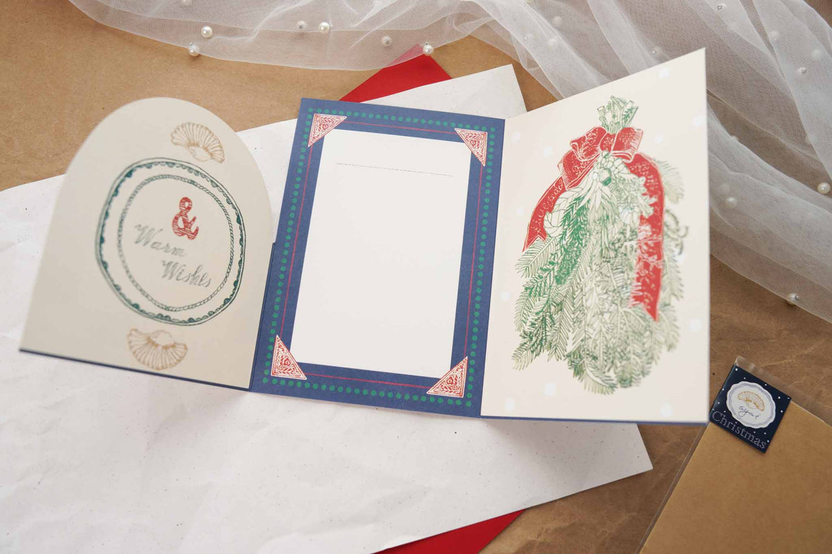 Aya Inoue Christmas trifold card opened showing writing area and holiday swag illustration