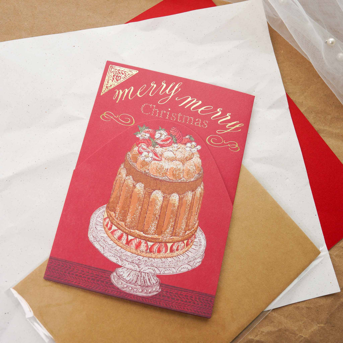 Aya Inoue Christmas trifold card front with elegant cake illustration on red background