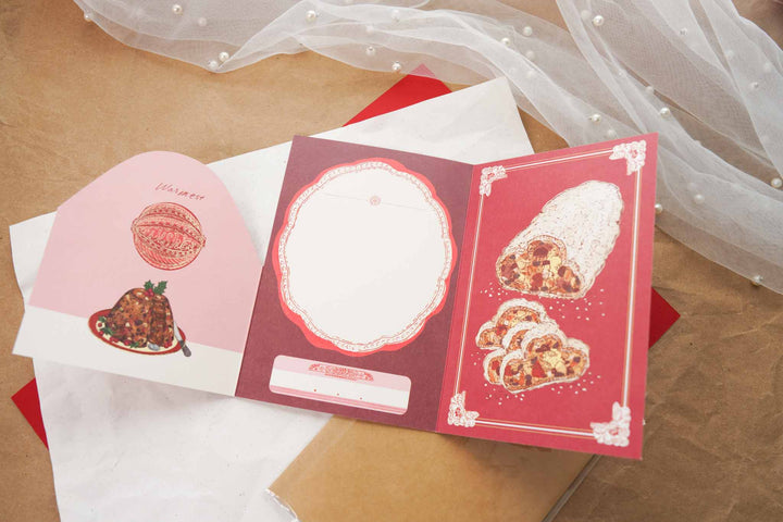 Aya Inoue Christmas trifold card opened showing writing area and stollen illustration
