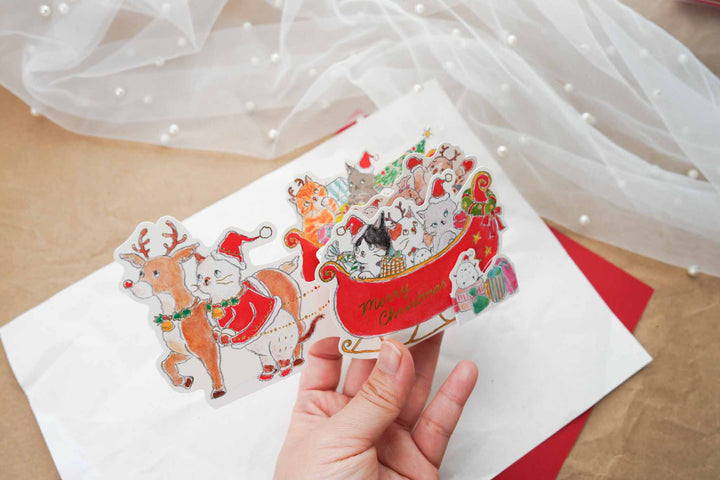 Tocoro Comugi Christmas pop-up card opened showing cats riding in sleigh